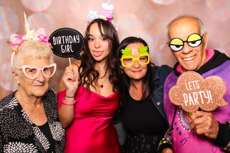 Birthday guests using props at Perth photo booth hire even