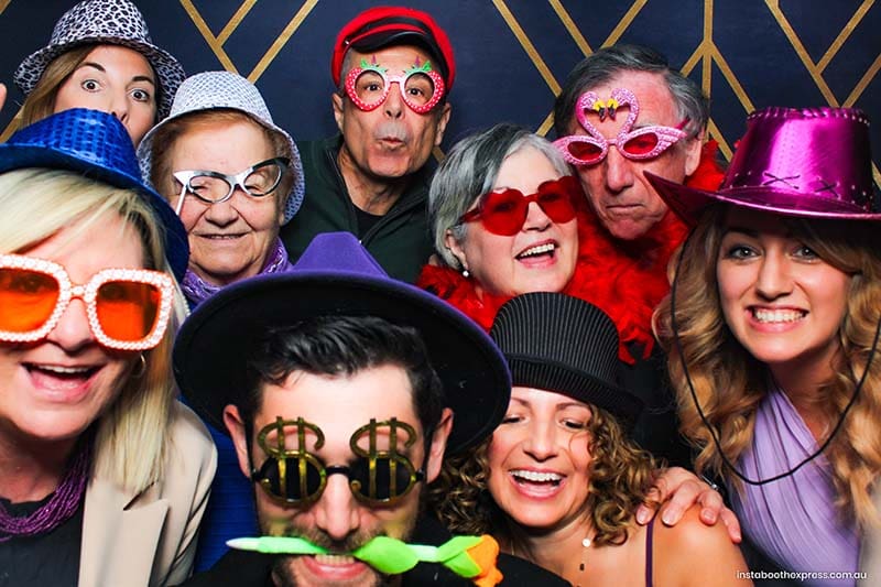 “Birthday guests using props at Perth photo booth hire event